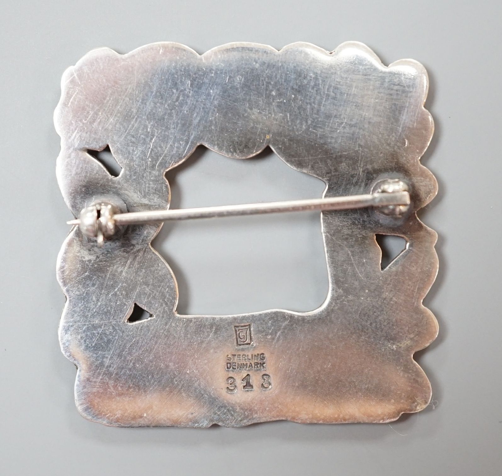 A Georg Jensen sterling 'recumbent deer with squirrel' square brooch, no. 318,36mm.